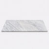 Carrara marble stone bathroom shower bench seat with a smooth surface, soft grey veining, and modern rectangular design.